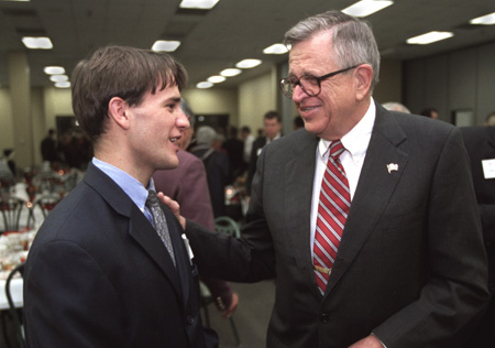 Freshman Christian Studies major Kevin Pratt speaks with Charles Colson after the Red Carpet Banquet.
 - Photo by Jim Veneman