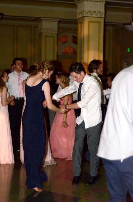 Ragan Pendley, sophomore art major, and Maclin Williamson, sophomore biology major, dance at the Cardinal Ball in downtown Jackson. - Photo by Meg Rushing
