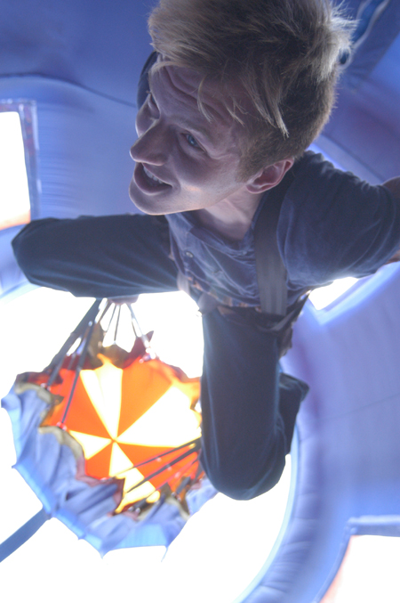 Senior Patrick Myers elevates in the parachute drop during Union's Fall Fest. - Photo by Jonathan Blair
