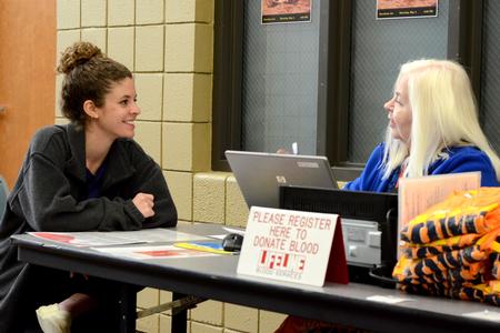Karis Lancaster, freshman english major, registers to donate to Lifeline Blood Services. - Photo by Meg Rushing