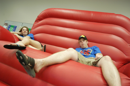 SAC members Emily Scheibe & Nick Moser chill on the large inflatable couch during Fall Fest '04. - Photo by Jonathan Blair