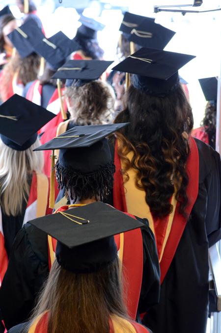 Students line up to enter spring commencement services at the Oman Arena. - Photo by MiKalla Cotton