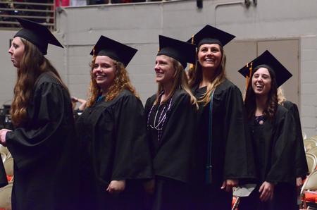 Students excitedly enter the Oman Arena for the spring commencement services.  - Photo by MiKalla Cotton