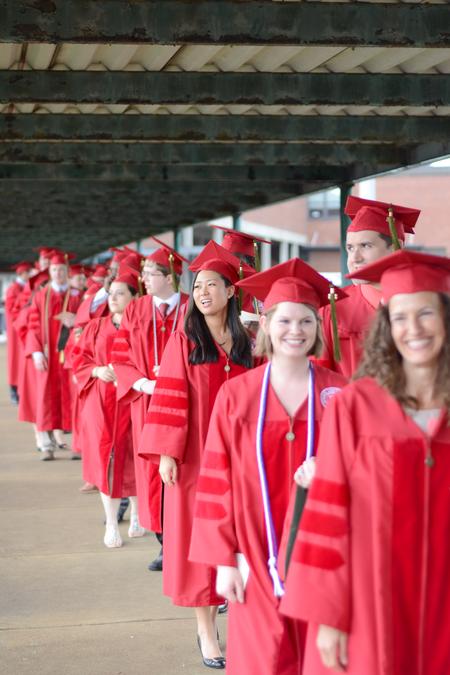 School of Pharmacy graduates line up before the spring commencement services begin. - Photo by David Parks