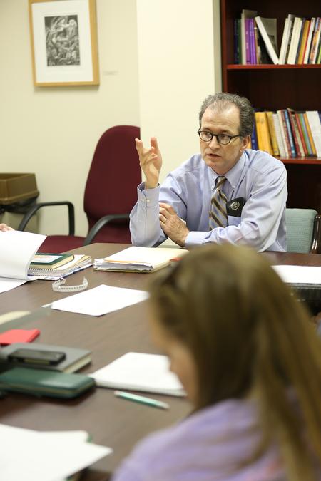 Bobby Rogers, professor of English and writer in residence, teaches a poetry class. - Photo by Kristi McMurry Woody