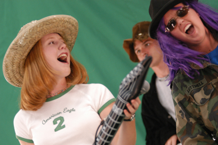 Freshman Abigail Carpenter and junior Jennifer Hanes rock out as they make a music video during Fall Fest '04.  - Photo by Jonathan Blair