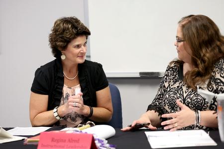 Regina Alred gives her final presentation for the M.Ed. program for Nancy Cherry, professor of education and director of M.A.Ed.. - Photo by Kristi McMurry Woody