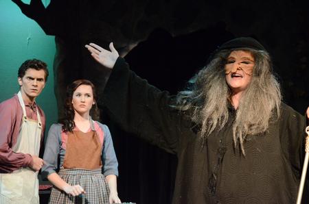 Abigail Peecher (right), freshman vocal performance major, performs the role of the witch in Into the Woods. - Photo by Emily Stookey