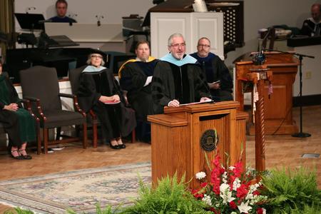 Sam Myatt, professor and assistant registrar, brings the commencement address at Summer Registration - Photo by Kristi McMurry Woody