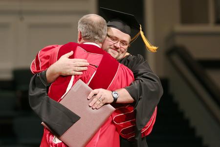 Timothy Parrish, master of science in nursing graduate, receives his diploma at Summer Graduation. - Photo by Kristi McMurry Woody
