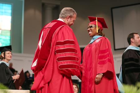 Rahonda Odom, doctor of education graduate, receives her diploma at Summer Graduation. - Photo by Kristi McMurry Woody