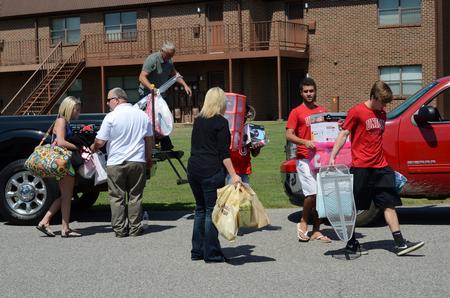Athletes help new students and their families unload on move-in day. - Photo by MiKalla Cotton