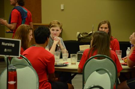 LeAnn Wilhite, assistant professor of nursing and chair of undergraduate nursing, meets new nursing students at the academic department dinner in Brewer dining hall during Welcome Week. - Photo by Elizabeth Wilson