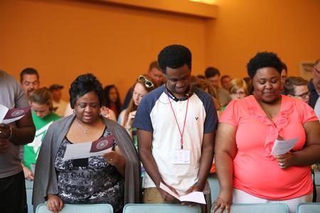New students and their families participate in a responsive reading during the Welcome Week chapel service. - Photo by Kristi McMurry Woody