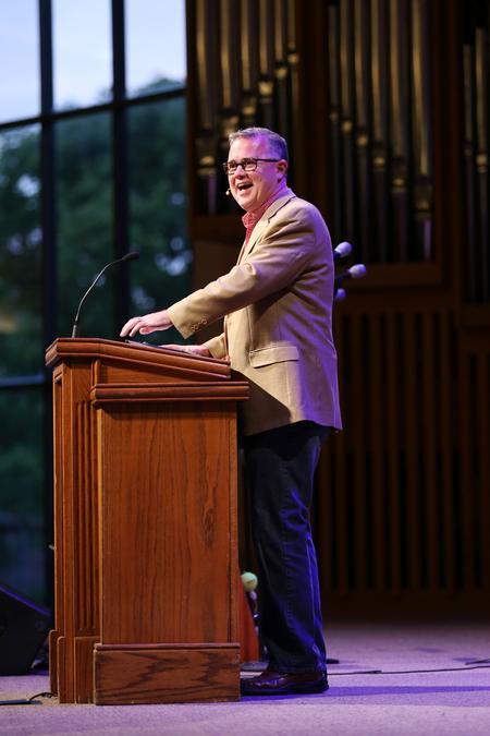 Todd Brady, vice president for university ministries, delivers a message to new students and their families following move-in day activities. - Photo by Kristi McMurry Woody