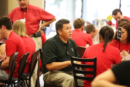 Andrew Tiger, acting chair of the business department, talks to new students interested in a business major during Welcome Week. - Photo by Kristi McMurry Woody