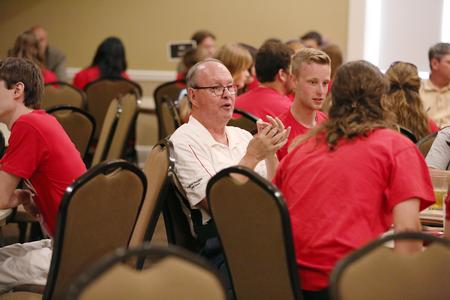 Linn Stranak, university professor of physical education and department chair, chats with new students interested in PEWS during Welcome Week. - Photo by Kristi McMurry Woody