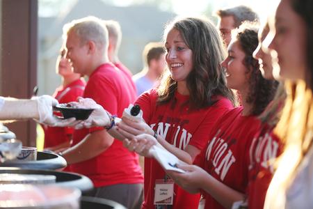 Melissa Lieffers, freshman, gets ice cream at the president's home during Welcome Week. - Photo by Kristi McMurry Woody
