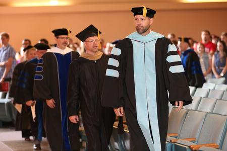 Bryan Carrier, vice president for student life and dean of students, processes into Convocation in the G.M. Savage Memorial Chapel. - Photo by Kristi McMurry Woody