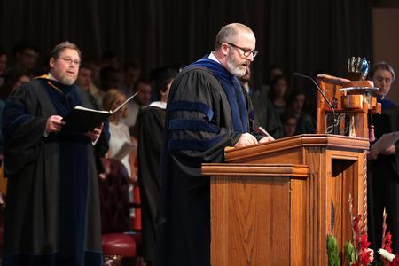 Nathan Finn, dean of the school of theology and missions, leads a responsive reading during Convocation. - Photo by Kristi McMurry Woody