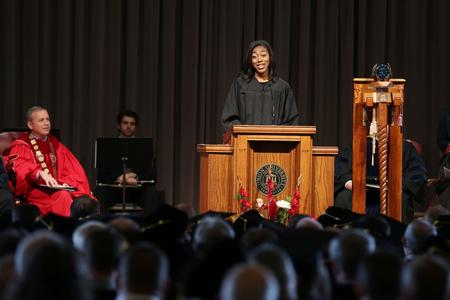 H.J., president of SGA, speaks to the congregation at Convocation. - Photo by Kristi McMurry Woody