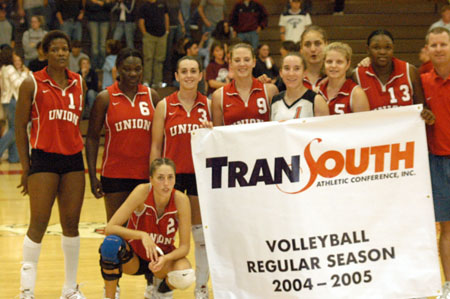 Union's volleyball celebrates with the TranSouth Regular Season Championship Banner. - Photo by Steven Aldridge