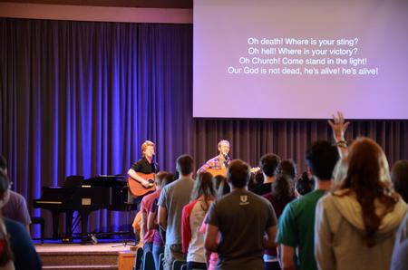 Connor Johnson, junior christian studies major, and Zach Lancaster senior art major, leads music in the G.M. Savage Memorial Chapel. - Photo by Elizabeth Wilson