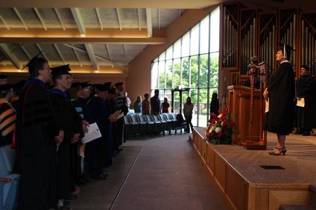 The congregation remains standing as the faculty of Union University enter the G.M. Savage Memorial Chapel for Fall Convocation. - Photo by Sol Bee Park