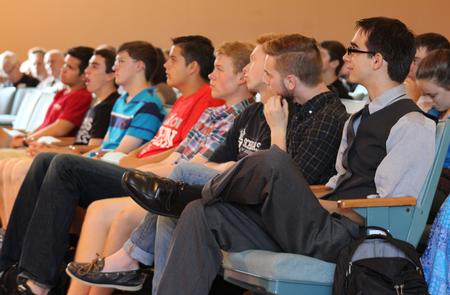 Students listen attentively in chapel, while Ashley Blair, assistant professor of communication arts, speaks. - Photo by Sol Bee Park