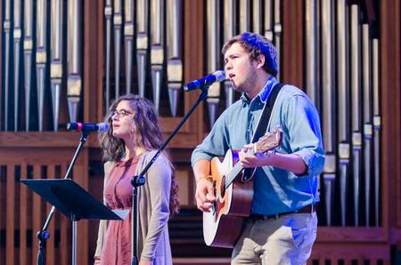 Eugenia Nestico, junior Spanish major, and Cameron Skonhovd, sophomore psychology and family studies major, lead worship in the G.M. Savage Memorial Chapel. - Photo by David Parks