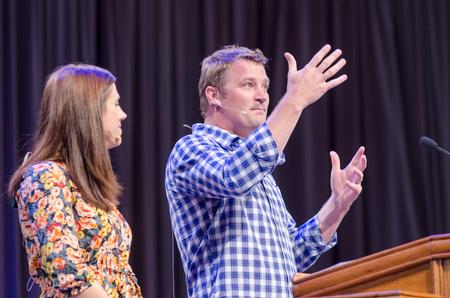 Corey and Melody Cain of Maplewood Baptist Church, Paris, Tennessee, tell the story of their daughter's adoption during chapel. - Photo by David Parks