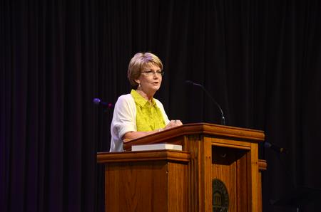 Susan Hopper, registrar in the academic center, introduces Steve Remington as the chapel speaker. - Photo by Elizabeth Wilson