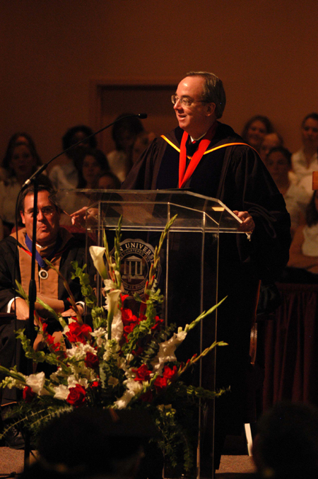 President Dockery speaks at Fall Convocation 2004.  Seated behind him is Dr. Keith Absher who was installed as the new dean of the McAfee School of Business Adminstration. - Photo by Morris Abernathy