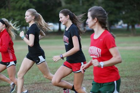 The women's cross country team finishes up an early morning practice on campus.  - Photo by Kristi McMurry Woody
