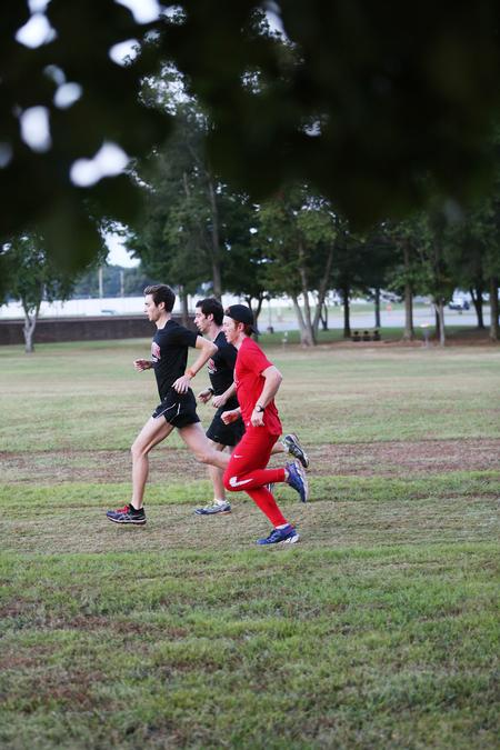 Men's cross country team members complete an early practice on the Union University XC course. - Photo by Kristi McMurry Woody