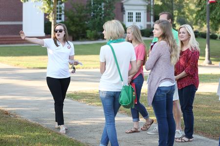 Julie Robinson, junior public relations major, gives a tour to prospective students and their families on a Day at the U.  - Photo by Kristi McMurry Woody