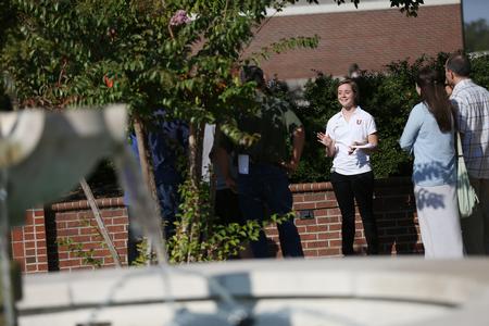 Lydia Atchley, junior conservation biology major, leads a tour group near the fountain on a Day at the U.  - Photo by Kristi McMurry Woody