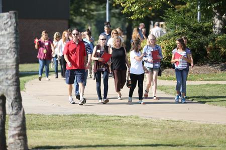 Tour groups walk around campus during Day at the U, a college preview day experience. - Photo by Kristi McMurry Woody
