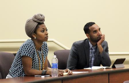 Melanie Taylor, ministry coordinator, and Matthew Marshall, director for service and diversity initiatives, listen attentively during a Town and Gown lecture. - Photo by Sol Bee Park