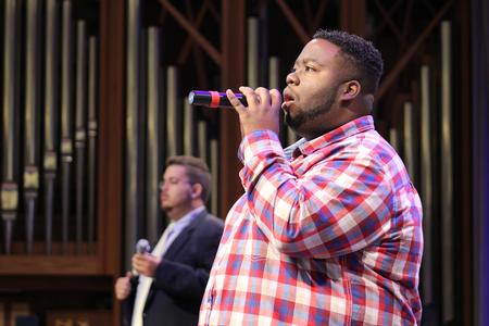 Cameron Jamar, sophomore music major, leads the congregation in a song during chapel. - Photo by Sol Bee Park