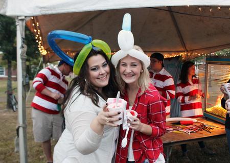 Students pose for a picture with their free balloons and treats, provided by Student Activities Council during Family Weekend's Union Night. - Photo by Sol Bee Park