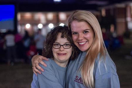 Kelsie Layman, freshman EDGE Program student, poses alongside her Chi Omega sister, Mary-Elizabeth Miller, senior exercise science/wellness major at the Student Activity Council's Movie on the Lawn during Family Weekend. - Photo by David Parks