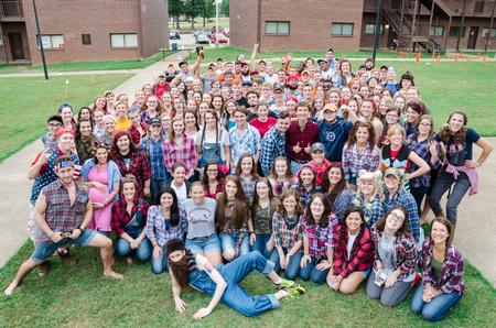 Students pose for a very "country" group photo for the annual DF Olympics on the Heritage Complex lawn. - Photo by David Parks