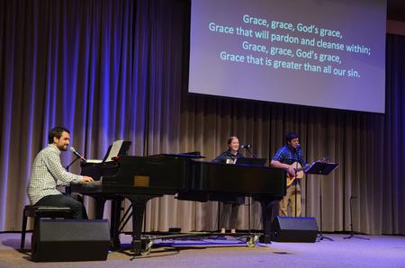 Cody Curtis, assistant resident director of men's quads and intramural coordinator, and his wife Melody, along with 
Cameron Skonhovd, junior psychology major, lead worship in the G.M. Savage Memorial Chapel. - Photo by Elizabeth Wilson