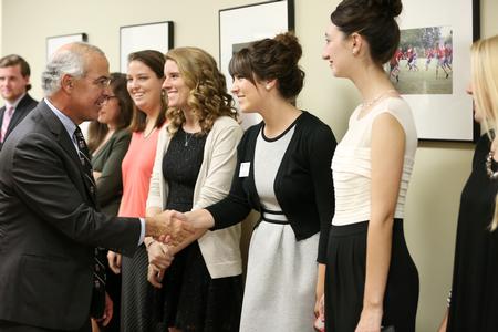 Kaylee Gibson, junior PR major, shakes hands with David Brooks, speaker at the 18th annual Scholarship Banquet.  - Photo by Kristi McMurry Woody