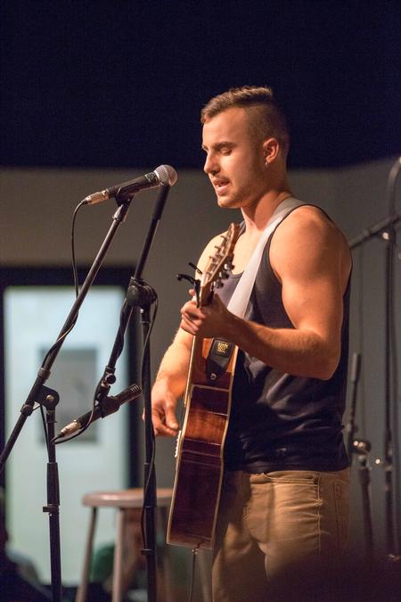 Caleb Smith, junior music major, plays a piece for Open Mic Night in Barefoots Joe. - Photo by David Parks