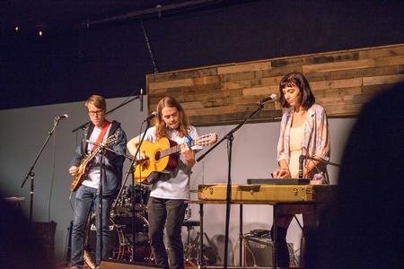 Joshua Mays, freshman conservation biology major, Beau Williams, junior english major, and Abigail  Brown, freshman nursing major, play for Open Mic Night in Barefoots Joe. - Photo by David Parks