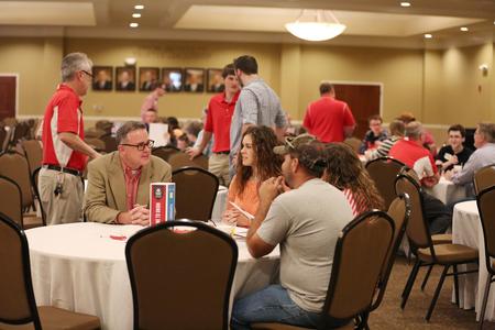 Todd Brady, vice president for university ministries, chats with a prospective student and her family at the fall Bulldog Days event. - Photo by Kristi McMurry Woody