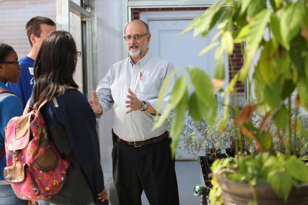 Wayne Wofford, professor of biology, gives prospective students who are interested in the sciences a tour of the new greenhouse. - Photo by Kristi McMurry Woody