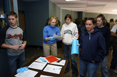 Dean of Students Kimberly Thornbury helped direct students to their projects during the Day of Remembrance. - Photo by Morris Abernathy
